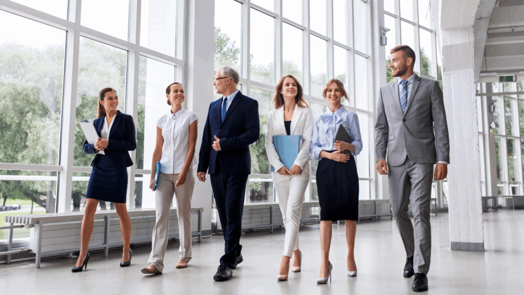 group of business people walking in suits